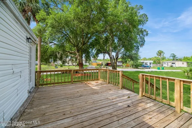 a view of deck with hardwood and lake view