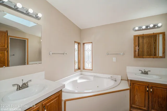 a bathroom with a sink a vanity and a mirror