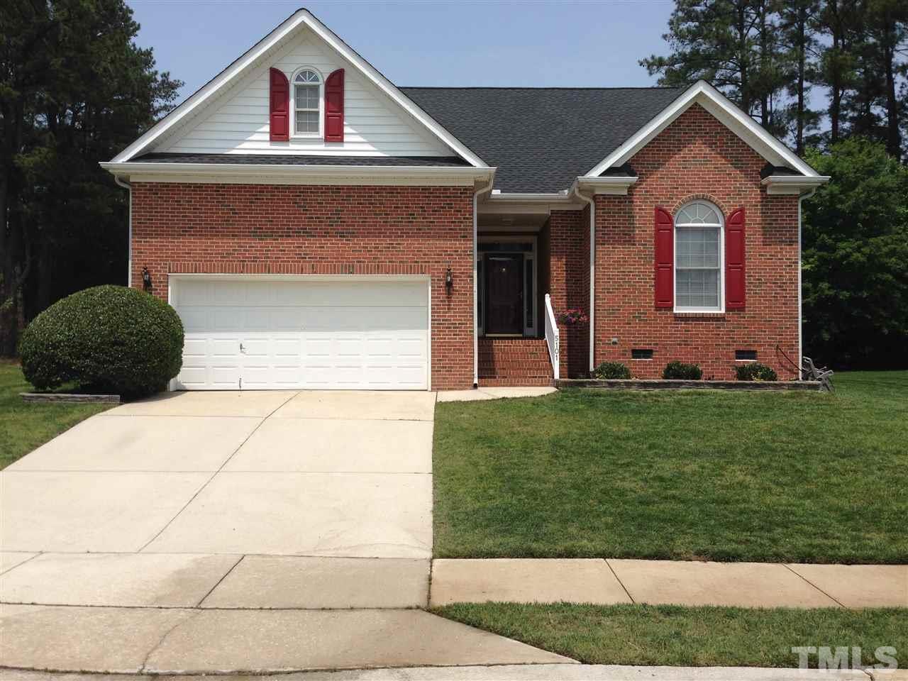5101 Amberfield Way Raleigh, NC 27604 - Photo 1 of 4 a front view of a house with a yard and garage