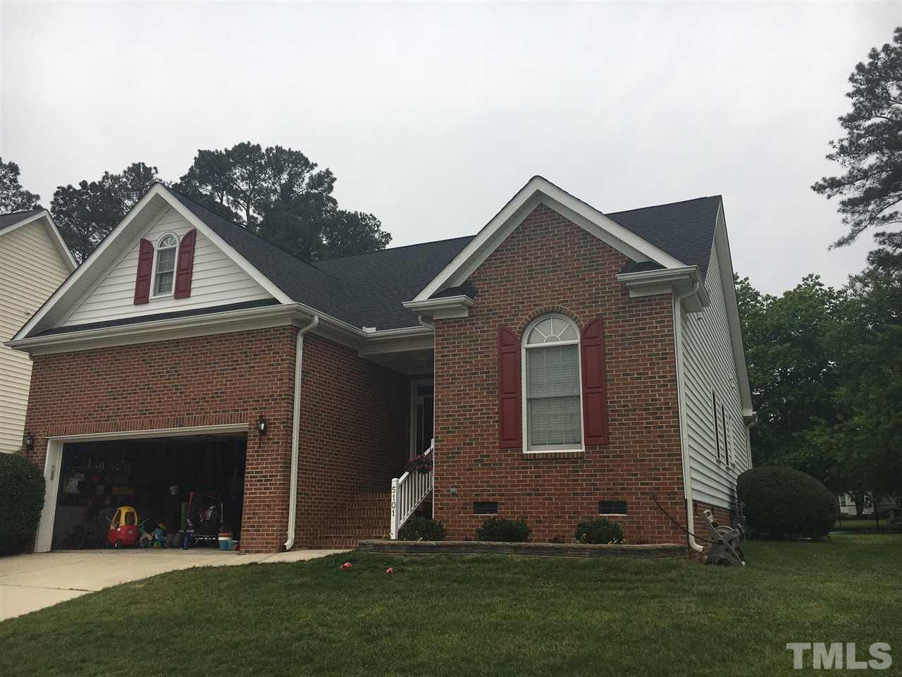 5101 Amberfield Way Raleigh, NC 27604 - Photo 2 of 4 a front view of a house with a garden and plants