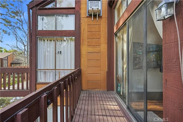 a view of a brick house with a glass door