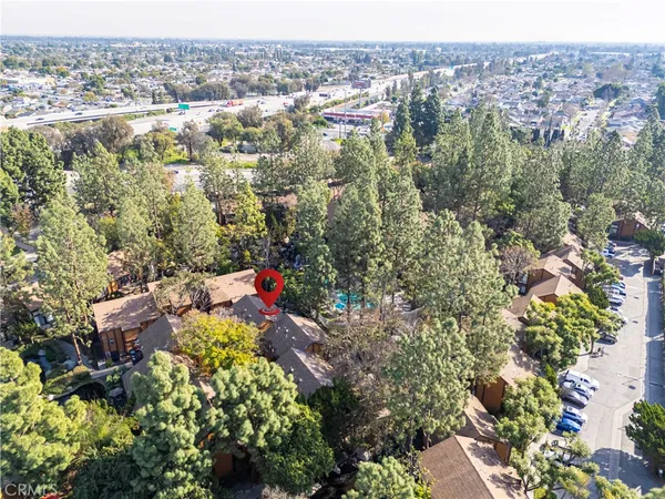 an aerial view of a houses with a yard