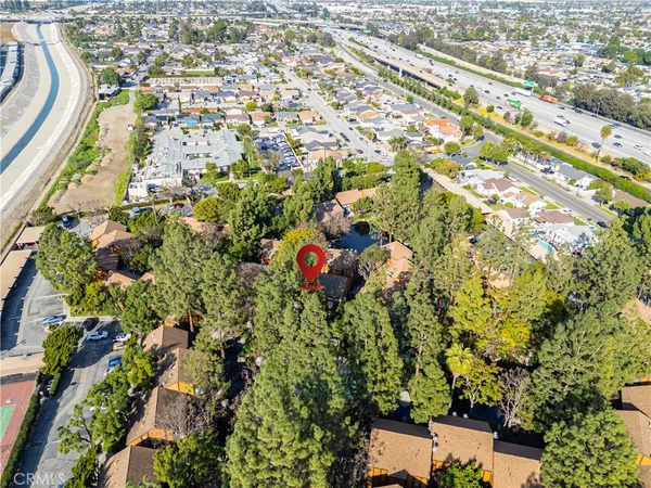 an aerial view of residential houses with outdoor space