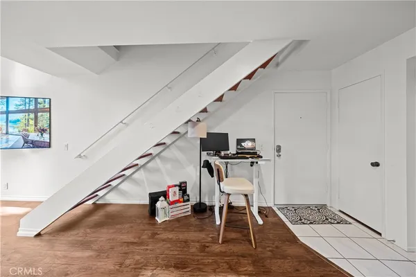 a living room with furniture and a rug
