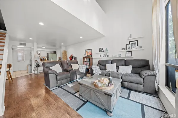 a living room with furniture and a rug