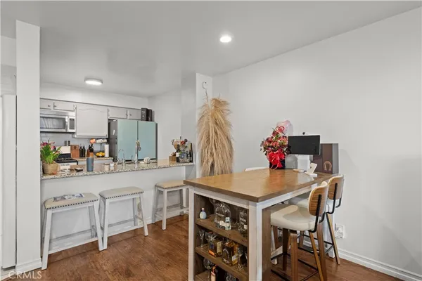 a kitchen with stainless steel appliances granite countertop a stove and a microwave