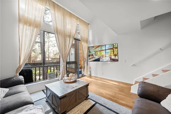 a kitchen with stainless steel appliances granite countertop a sink refrigerator and microwave