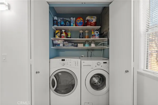 a kitchen with stainless steel appliances granite countertop a refrigerator stove a sink and a microwave