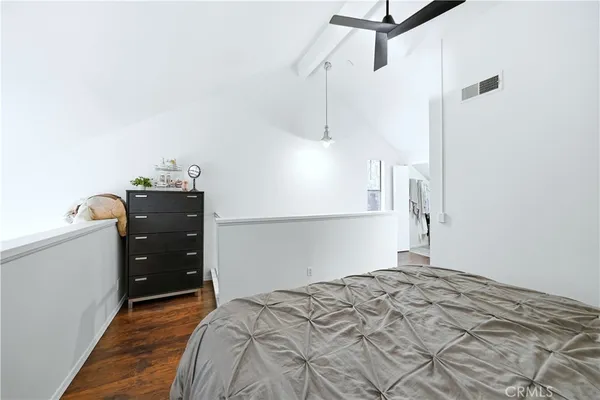 a bedroom with a bed and a cabinets