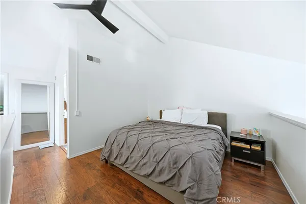 a bedroom with a bed and a table