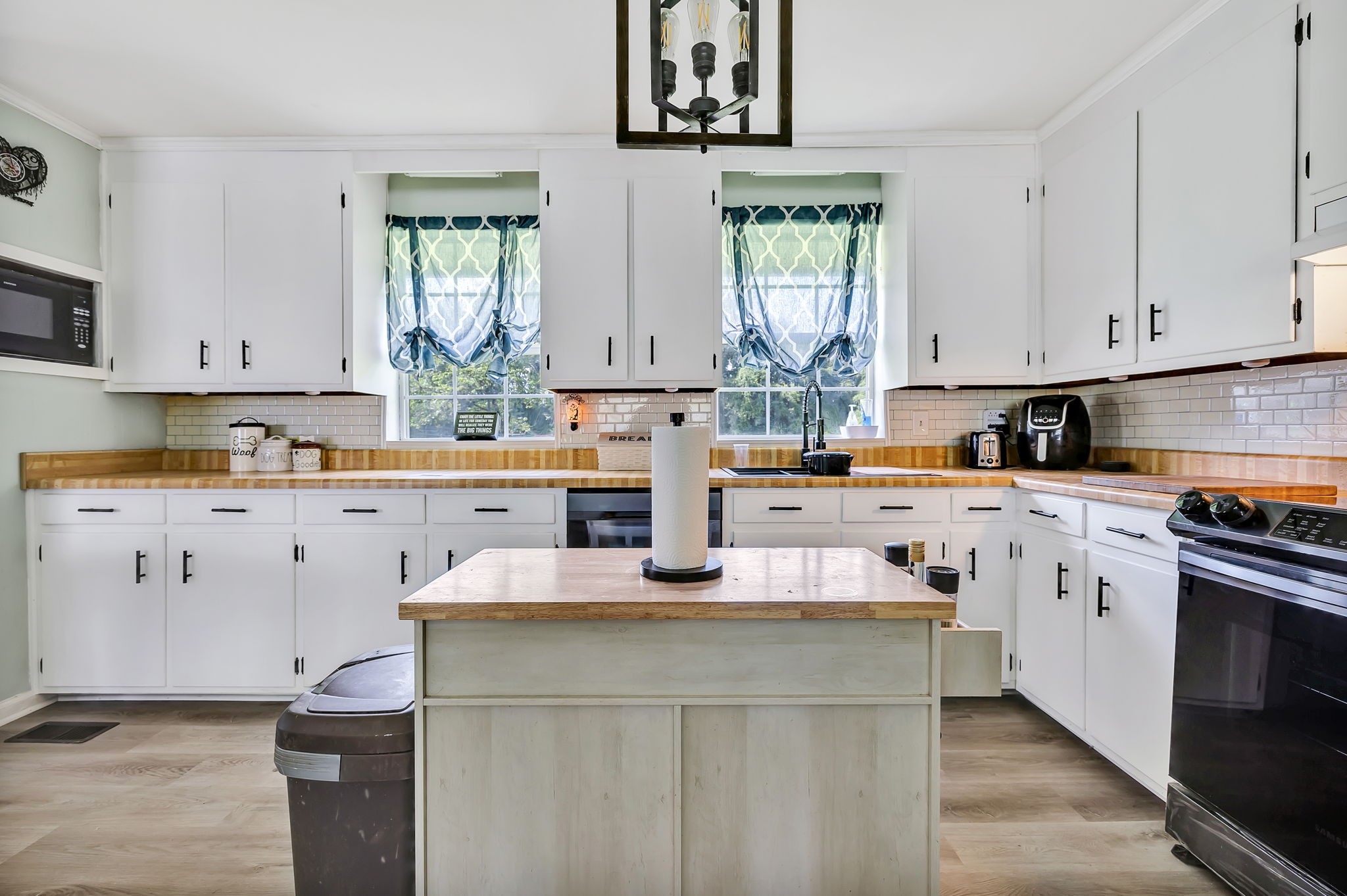 436 Youree Road Murfreesboro, TN 37127 - Photo 12 of 32 a kitchen with cabinets appliances a sink and a window