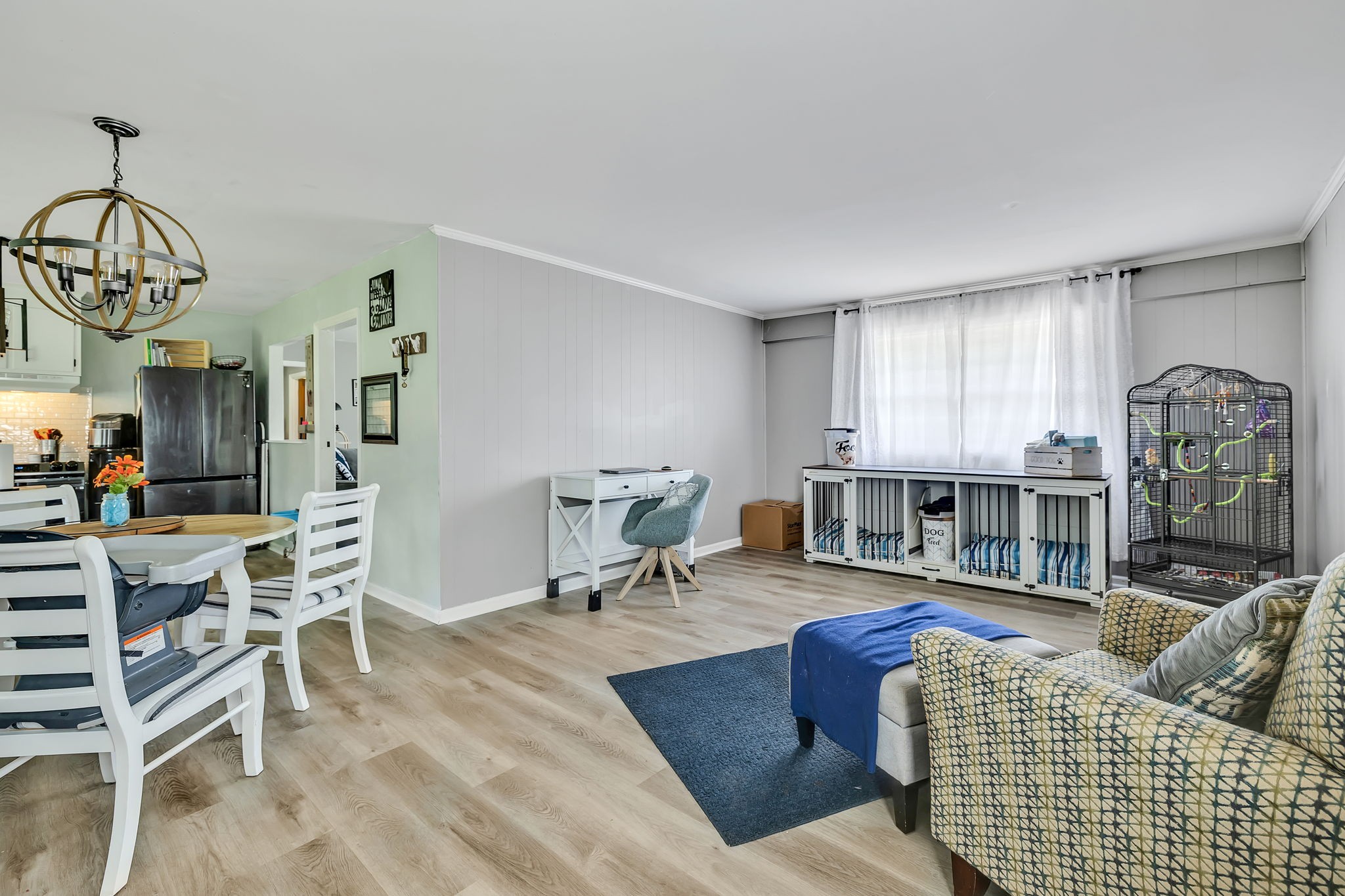 436 Youree Road Murfreesboro, TN 37127 - Photo 17 of 32 a living room with furniture a dining table and a chandelier