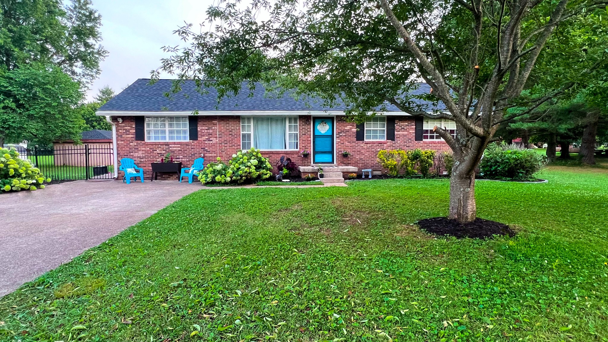 436 Youree Road Murfreesboro, TN 37127 - Photo 2 of 32 a front view of a house with a garden and trees