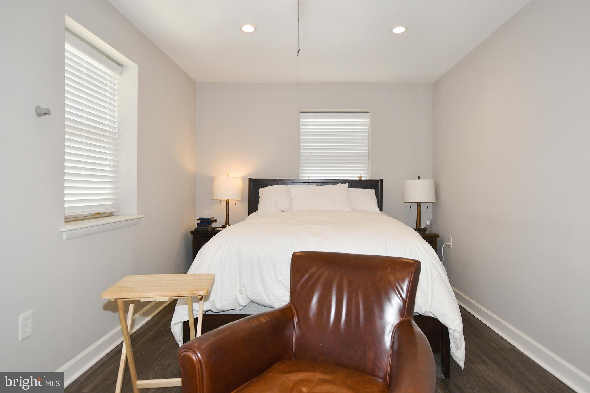 2900 Pomeroy Road Southeast, Unit 104 Washington, DC 20020 - Photo 17 of 19 a bedroom with a bed and window