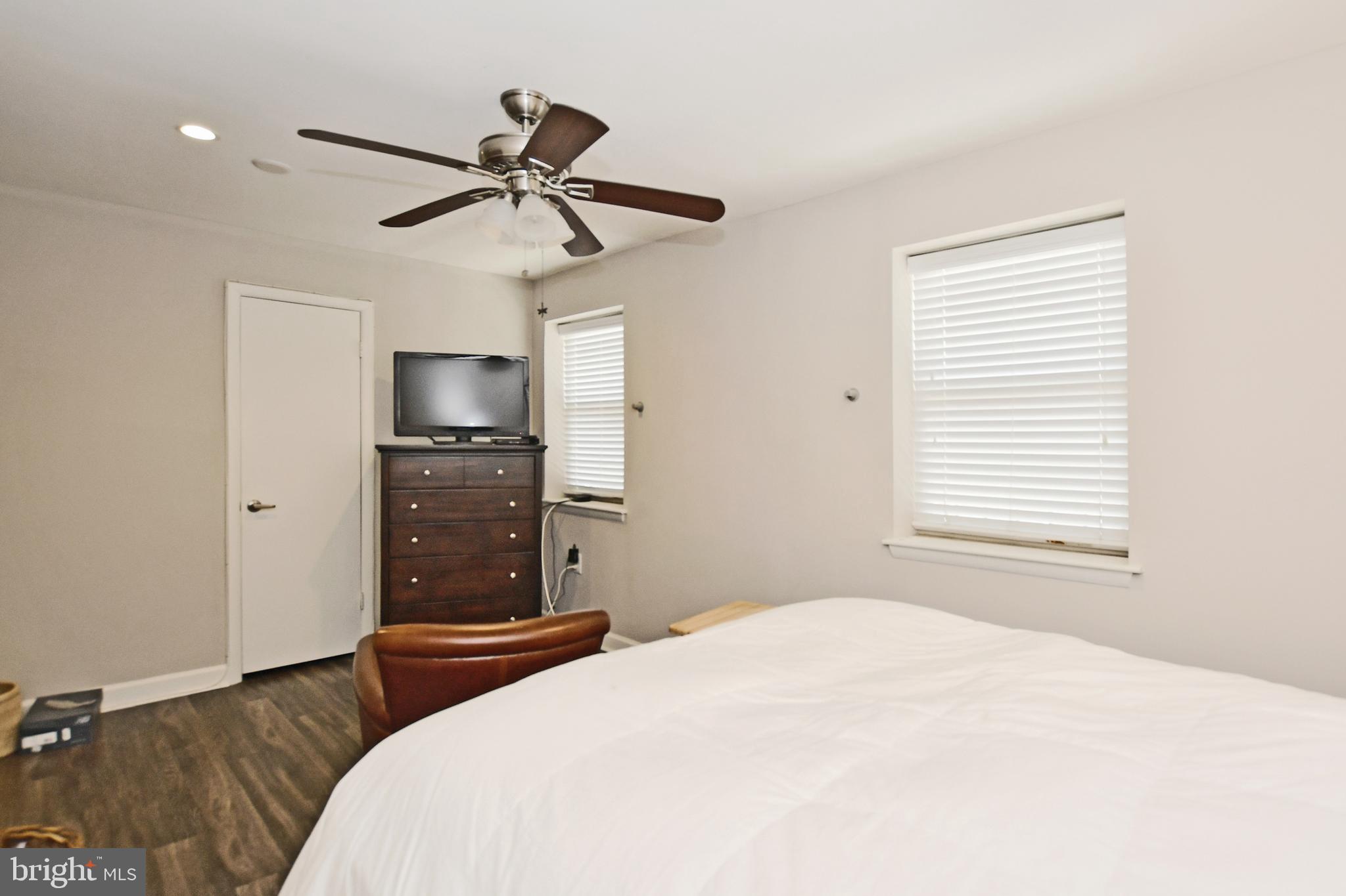 2900 Pomeroy Road Southeast, Unit 104 Washington, DC 20020 - Photo 19 of 19 a bedroom with a bed and a chandelier