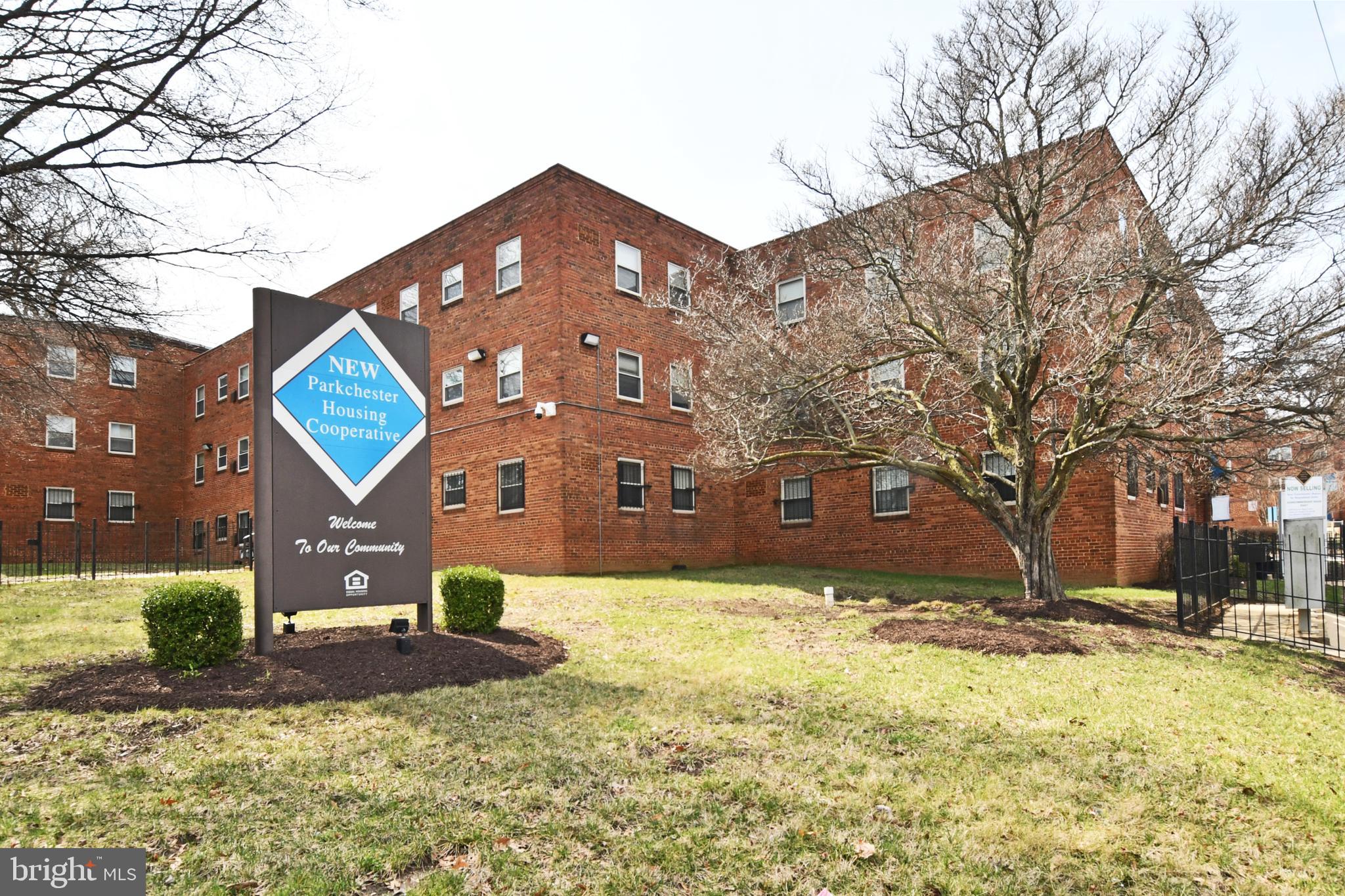 2900 Pomeroy Road Southeast, Unit 104 Washington, DC 20020 - Photo 2 of 19 a front view of a house with a yard
