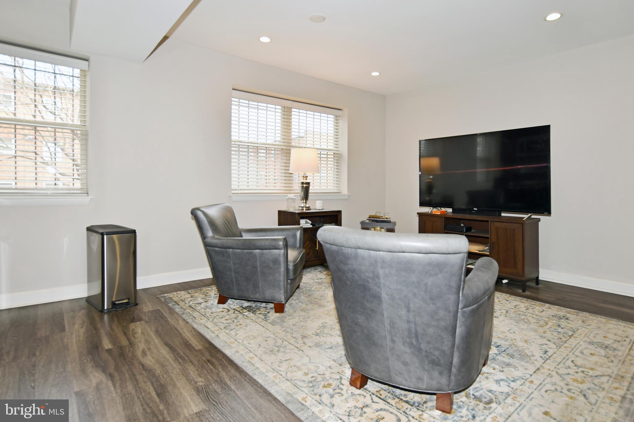 2900 Pomeroy Road Southeast, Unit 104 Washington, DC 20020 - Photo 8 of 19 a living room with furniture and a flat screen tv