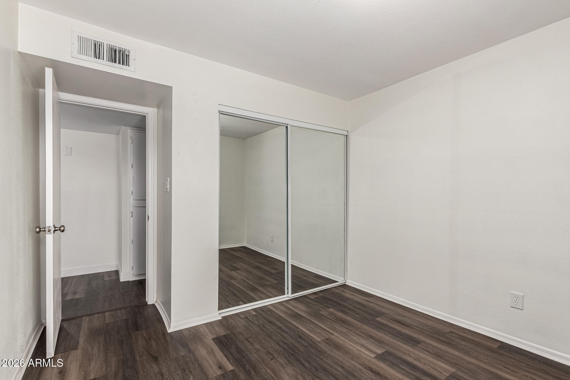 2540 West Roveen Avenue Phoenix, AZ 85029 - Photo 22 of 31 a view of a hallway with wooden floor