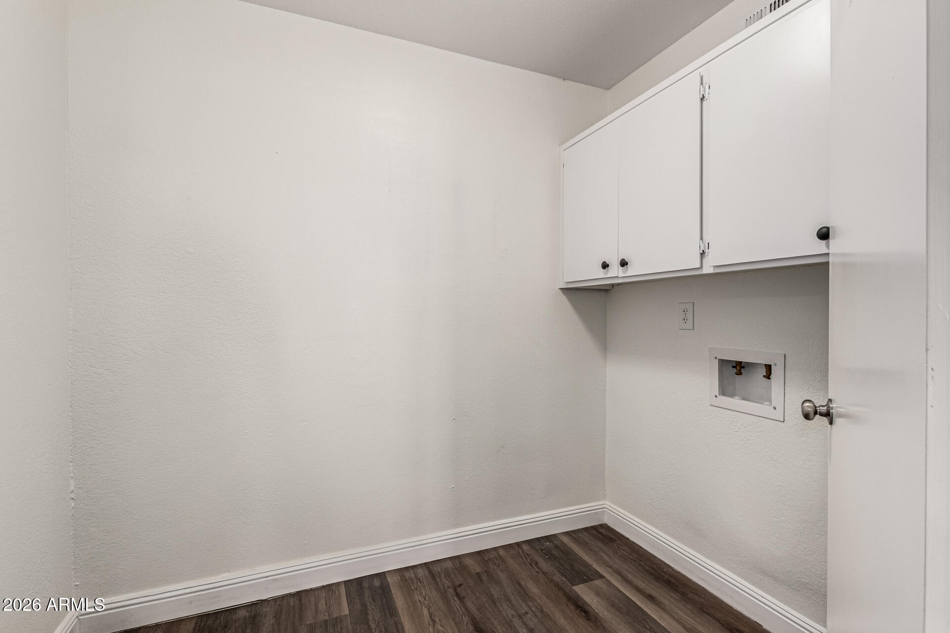 2540 West Roveen Avenue Phoenix, AZ 85029 - Photo 26 of 31 a view of storage and utility room with wooden floor