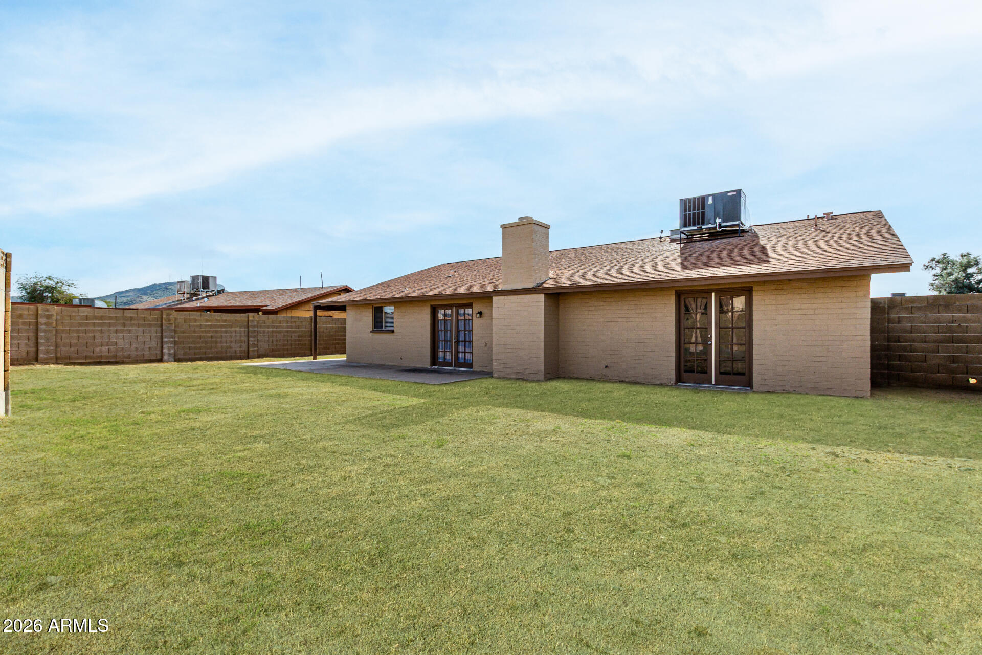 2540 West Roveen Avenue Phoenix, AZ 85029 - Photo 30 of 31 a front view of a house with a garden