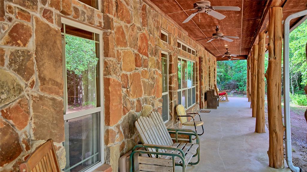 4509 Lazy E Road St. Jo, TX 76265 - Photo 29 of 39 a view of a patio with table and chairs and potted plants