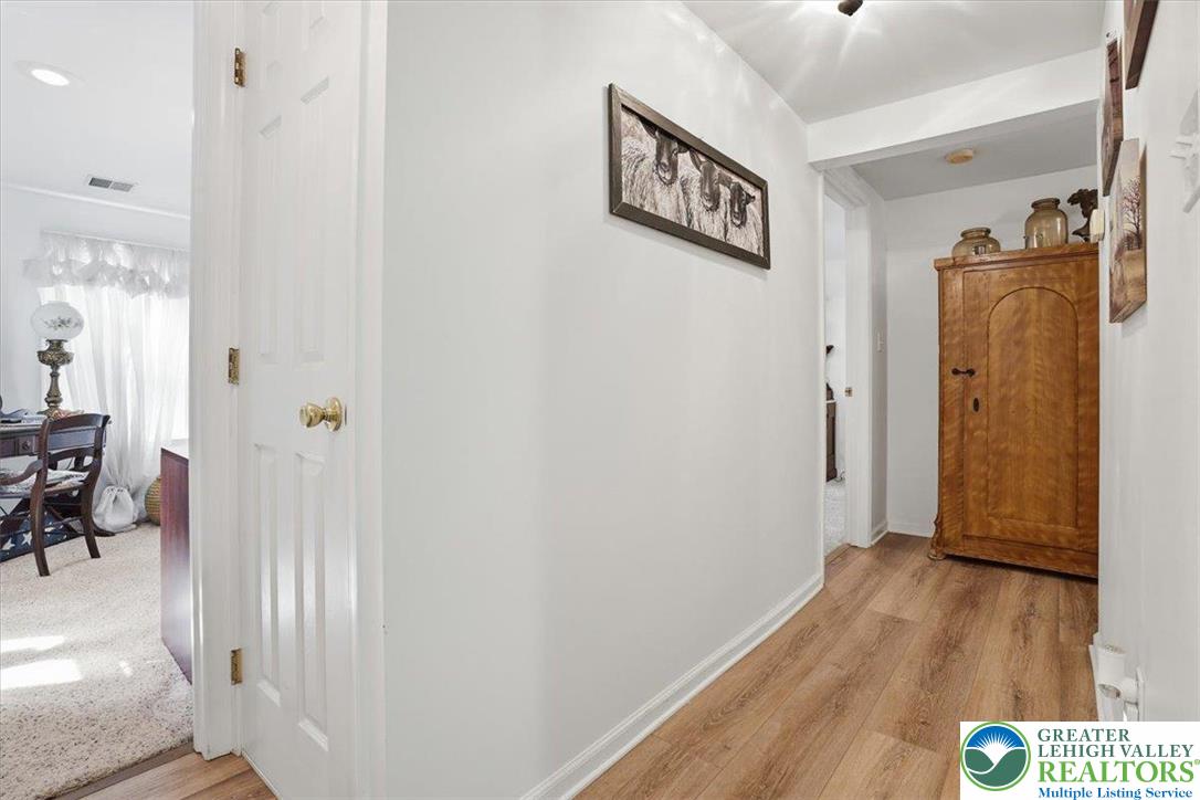 4880 Little Gap Road Kunkletown, PA 18058 - Photo 11 of 100 This welcoming hallway showcases durable flooring and offers a glimpse into adjacent rooms.