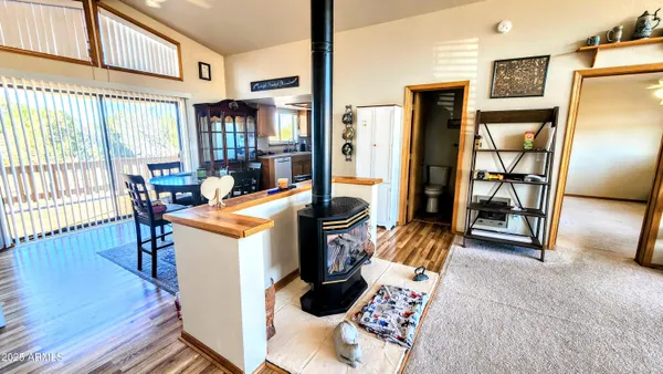 a view of living room with furniture and floor to ceiling window