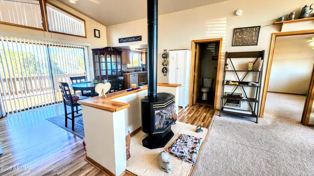 a view of living room with furniture and floor to ceiling window