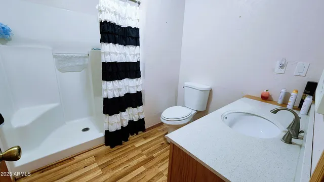 a bed room with a bed tv and a fireplace