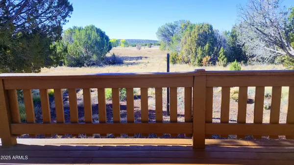 a view of a house with a wooden deck