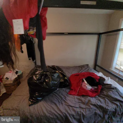 a room with a wooden floor and shoes