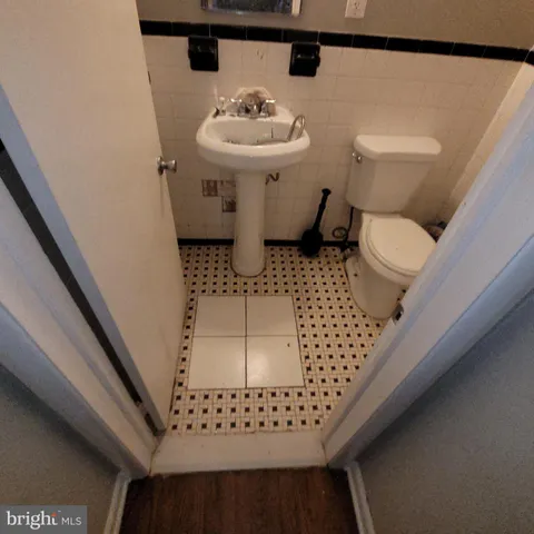 a bathroom with a toilet and a sink