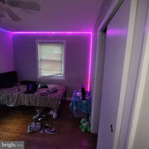 a bed room with a bed chair and a window