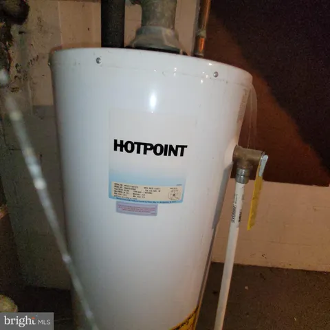 a bedroom with furniture and a wooden floor