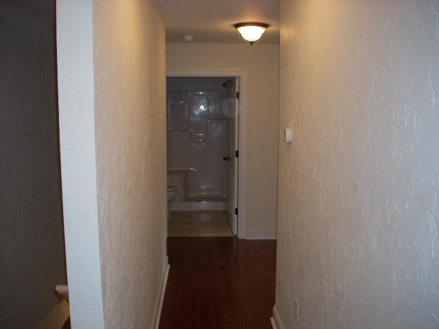 1071 Chandler Road Goodview, VA 24095 - Photo 14 of 17 a bathroom with a glass shower door