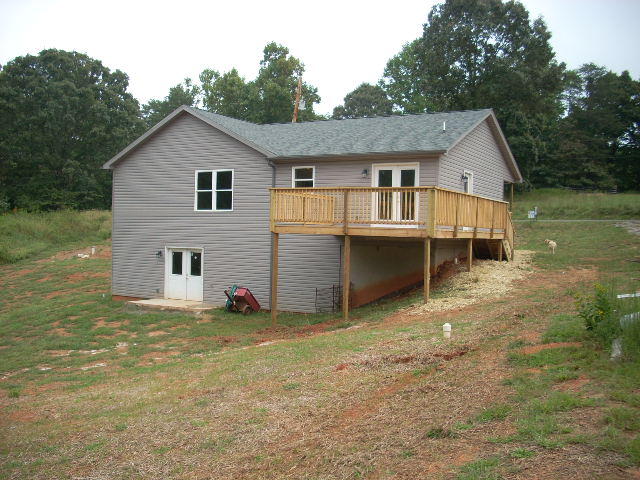 1071 Chandler Road Goodview, VA 24095 - Photo 4 of 17 a view of a house with backyard porch and garden