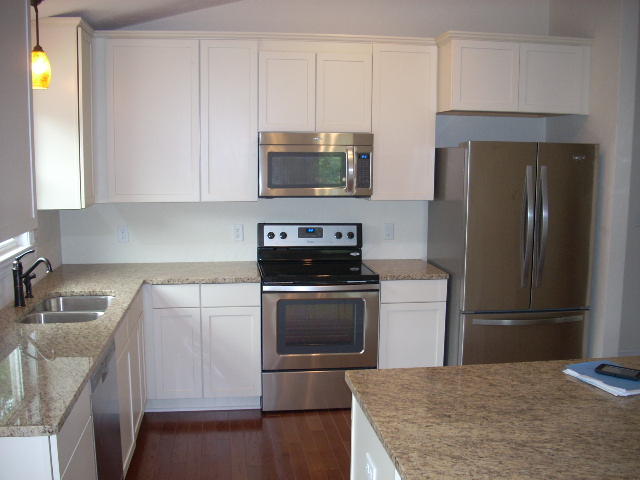 1071 Chandler Road Goodview, VA 24095 - Photo 7 of 17 a kitchen with a sink stove and refrigerator
