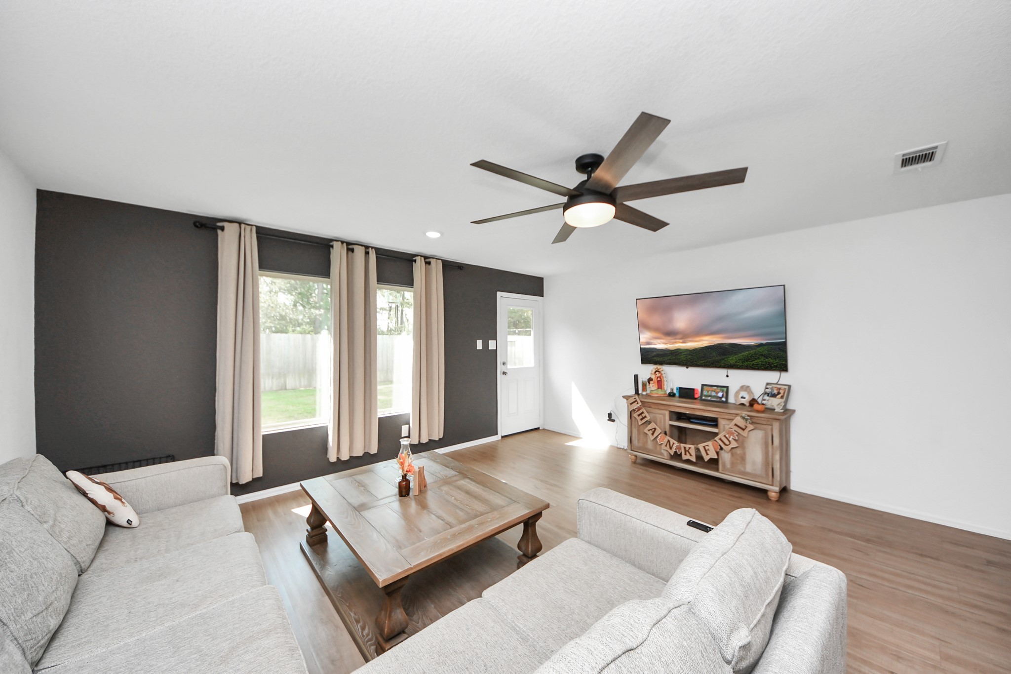 22828 Great Egret Drive Splendora, TX 77372 - Photo 11 of 39 a living room with furniture and a flat screen tv