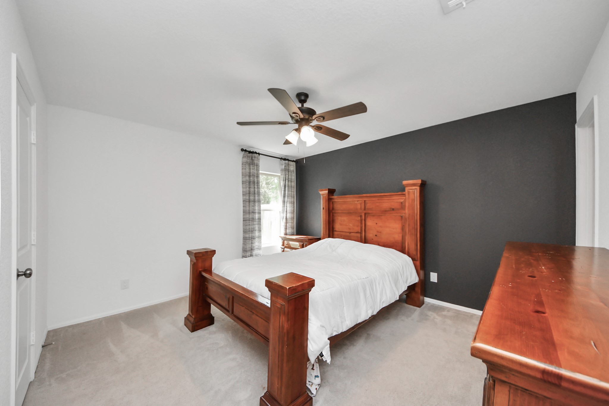 22828 Great Egret Drive Splendora, TX 77372 - Photo 13 of 39 a bedroom with a bed and window