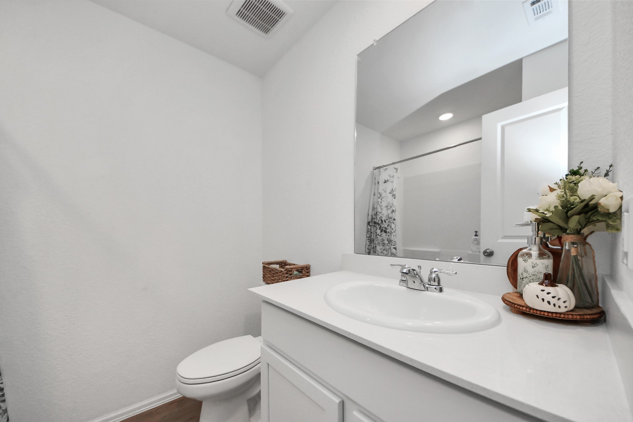 22828 Great Egret Drive Splendora, TX 77372 - Photo 16 of 39 a bathroom with a sink toilet and a mirror