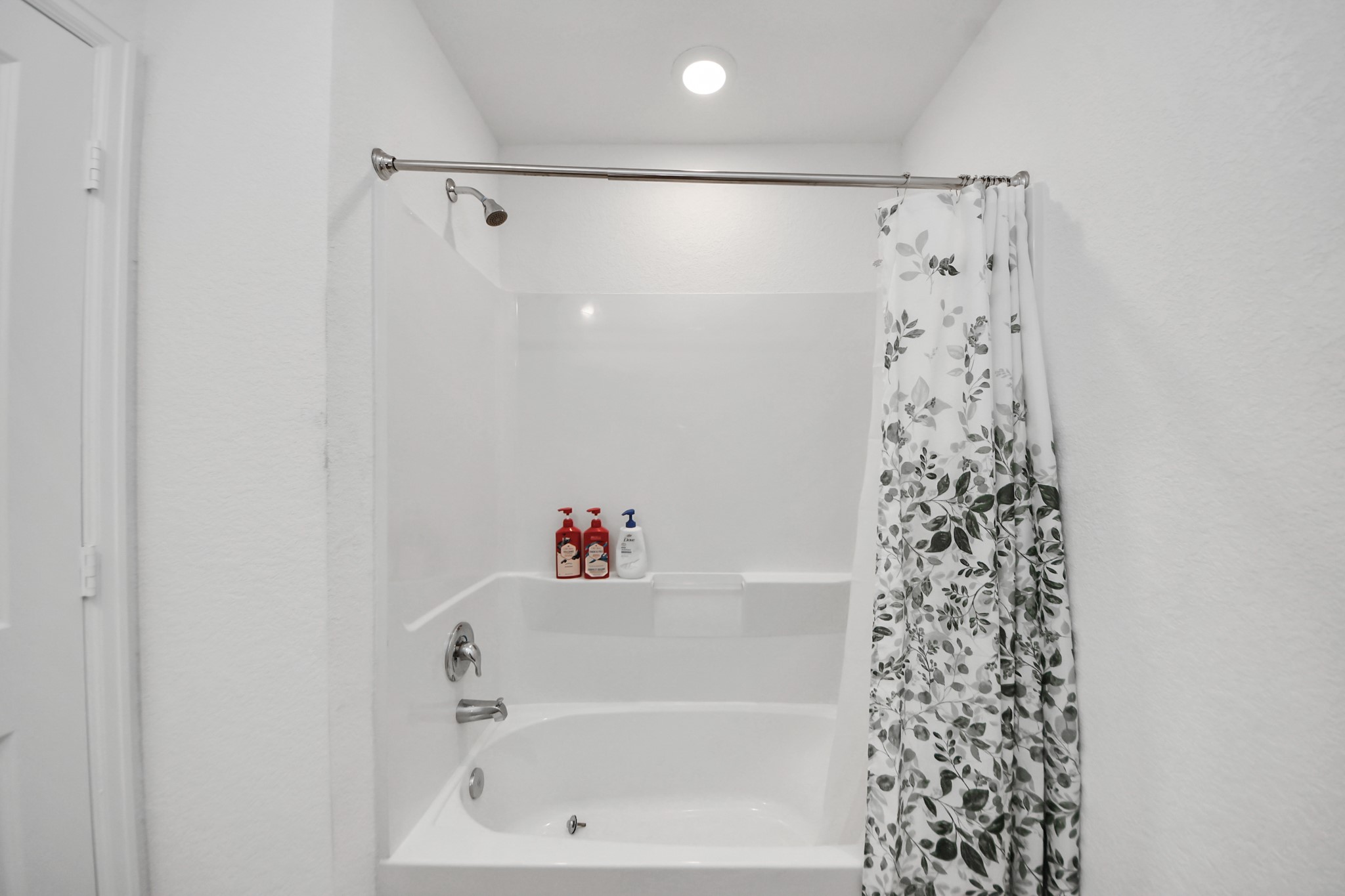 22828 Great Egret Drive Splendora, TX 77372 - Photo 17 of 39 a bathroom with a bathtub and shower