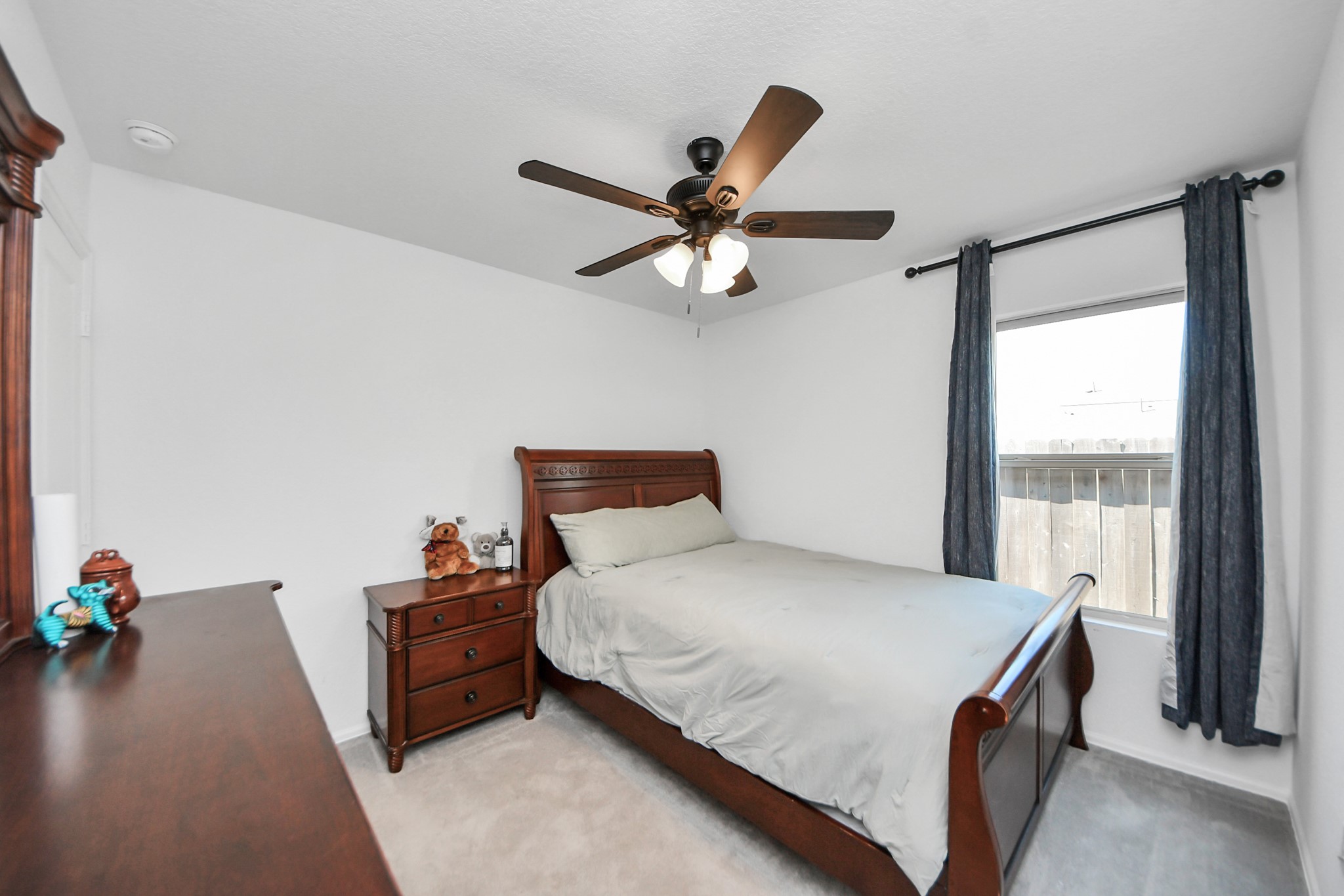 22828 Great Egret Drive Splendora, TX 77372 - Photo 19 of 39 a bedroom with a bed and a window