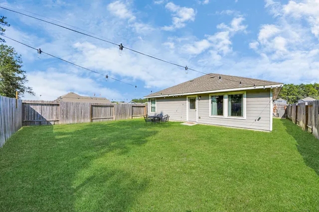 a view of a yard in front of a house