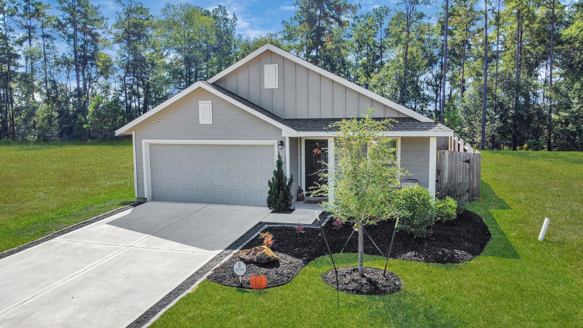 22828 Great Egret Drive Splendora, TX 77372 - Photo 21 of 39 a view of a house with backyard and garden