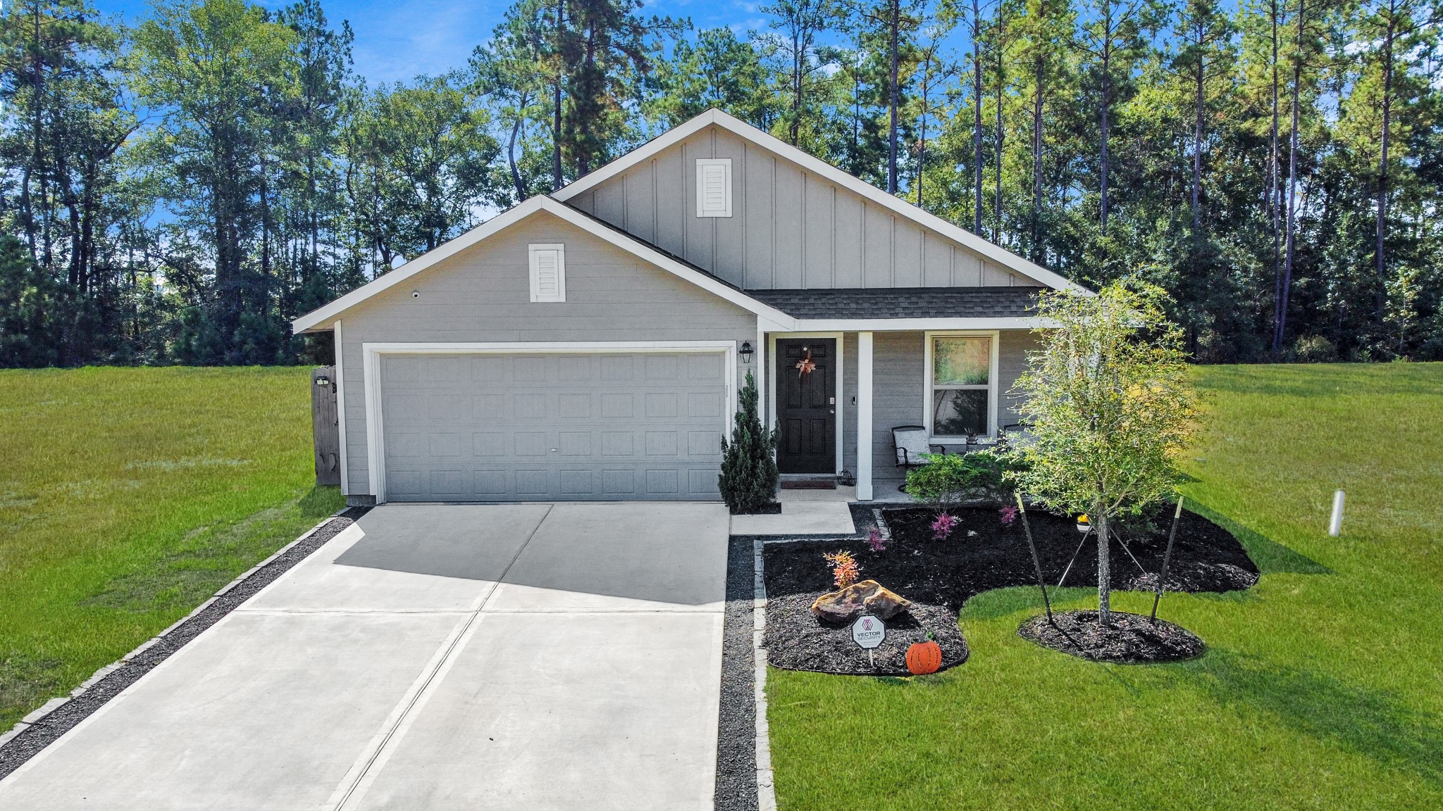 22828 Great Egret Drive Splendora, TX 77372 - Photo 22 of 39 a front view of house with a garden