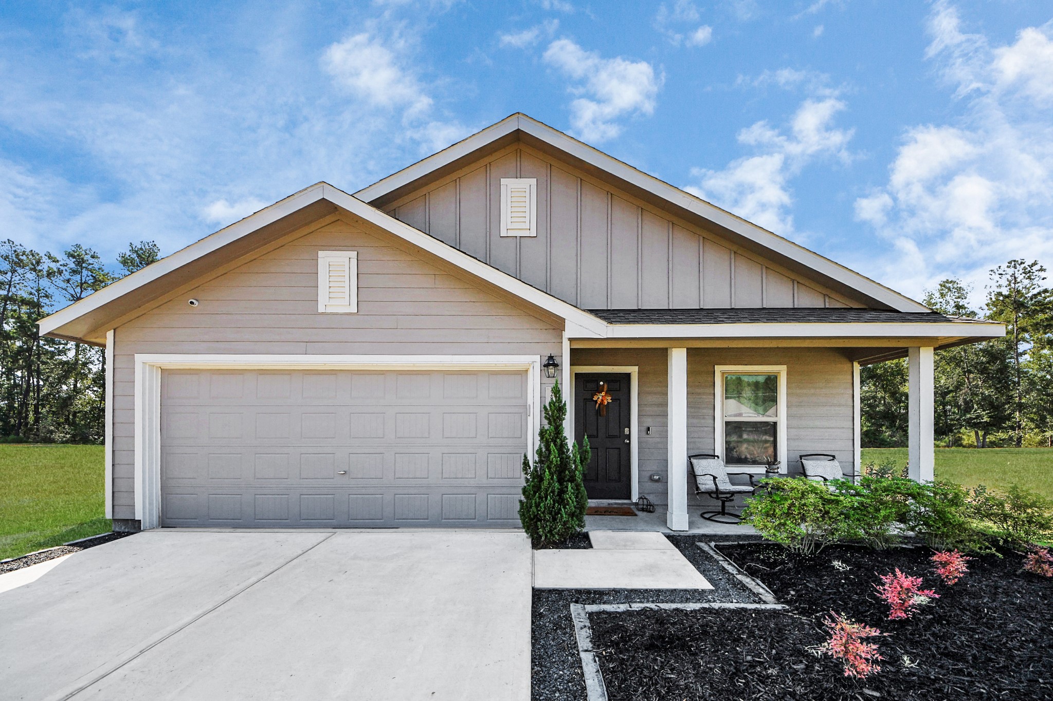 22828 Great Egret Drive Splendora, TX 77372 - Photo 28 of 39 a front view of a house with a yard