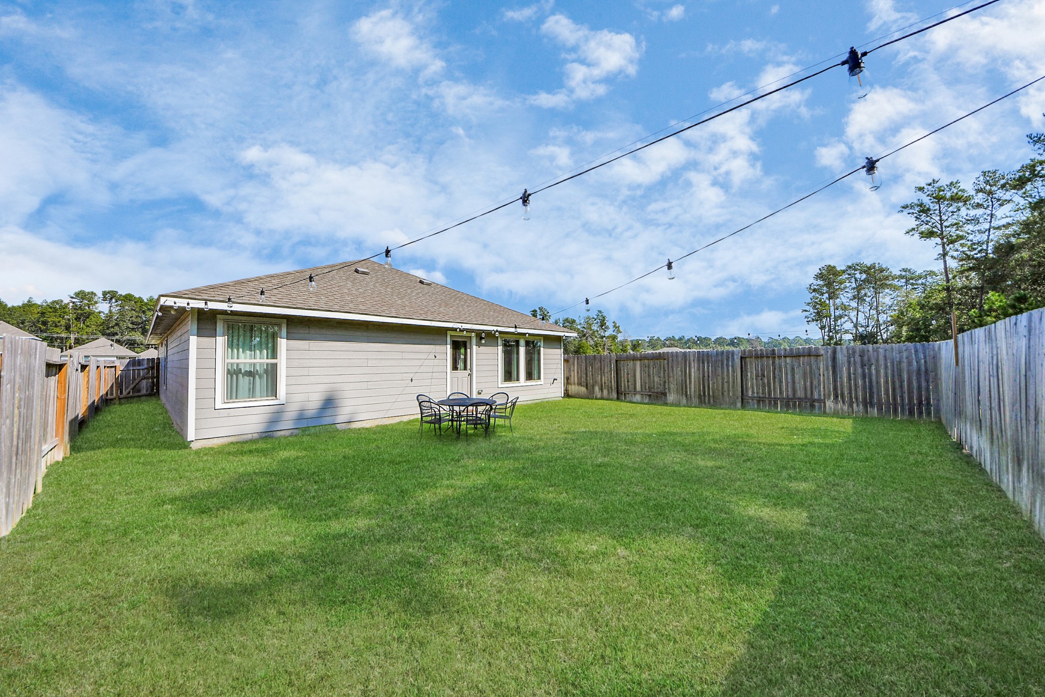 22828 Great Egret Drive Splendora, TX 77372 - Photo 32 of 39 a front view of a house with garden