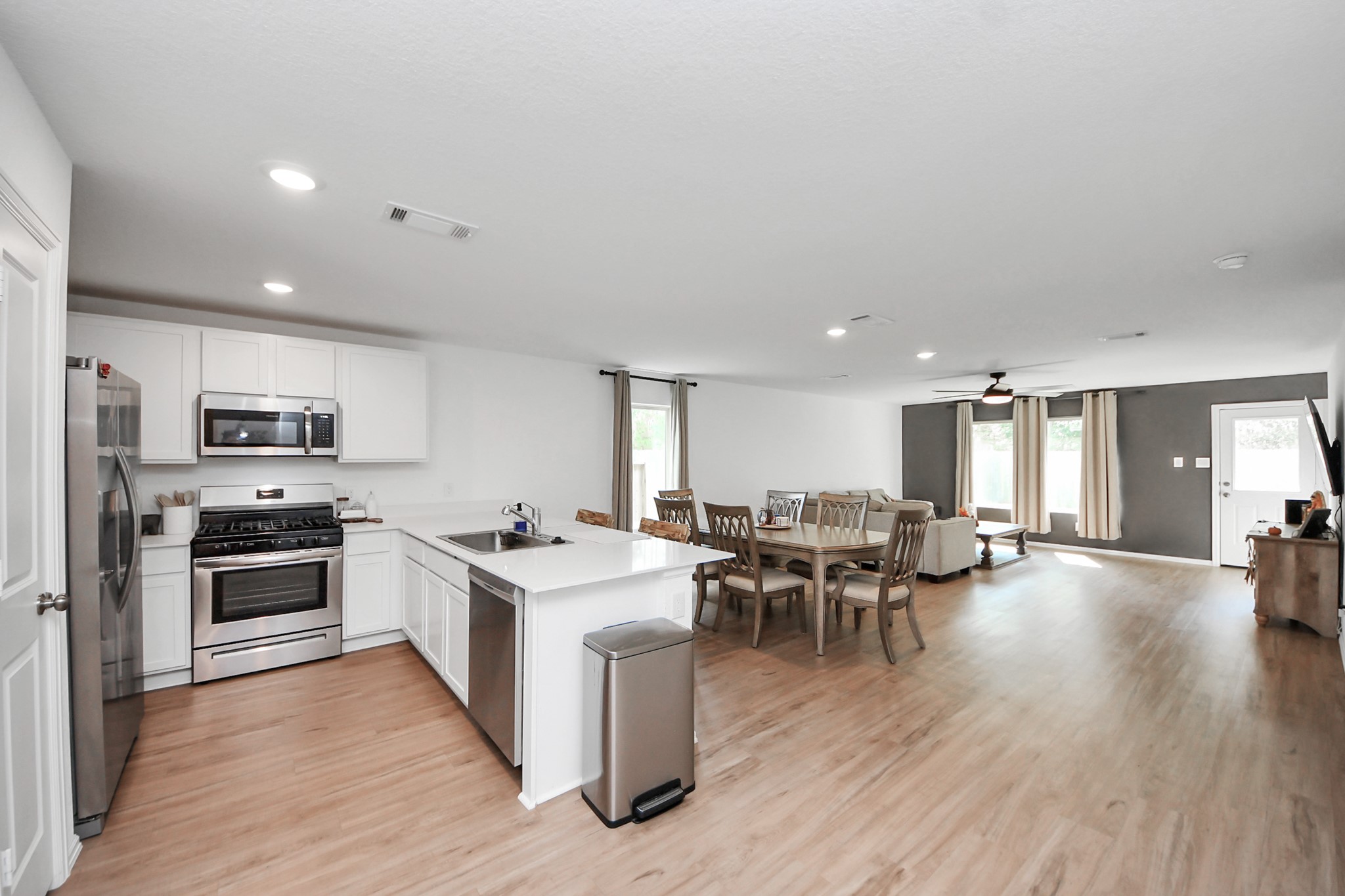 22828 Great Egret Drive Splendora, TX 77372 - Photo 5 of 39 a large kitchen with a table and chairs
