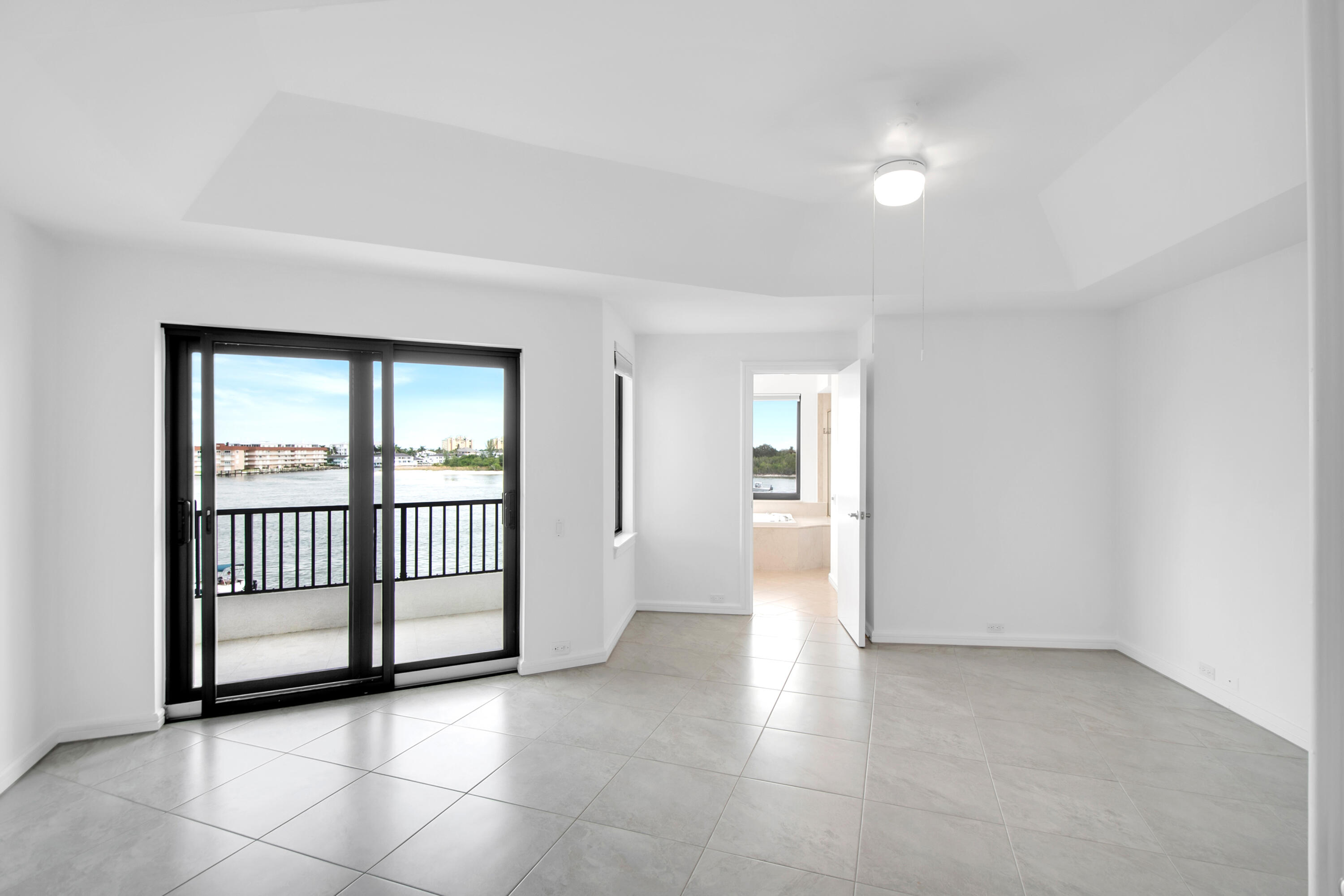 231 La Peninsula Boulevard, Unit 231 Naples, FL 34113 - Photo 19 of 42 a view of a big room with windows