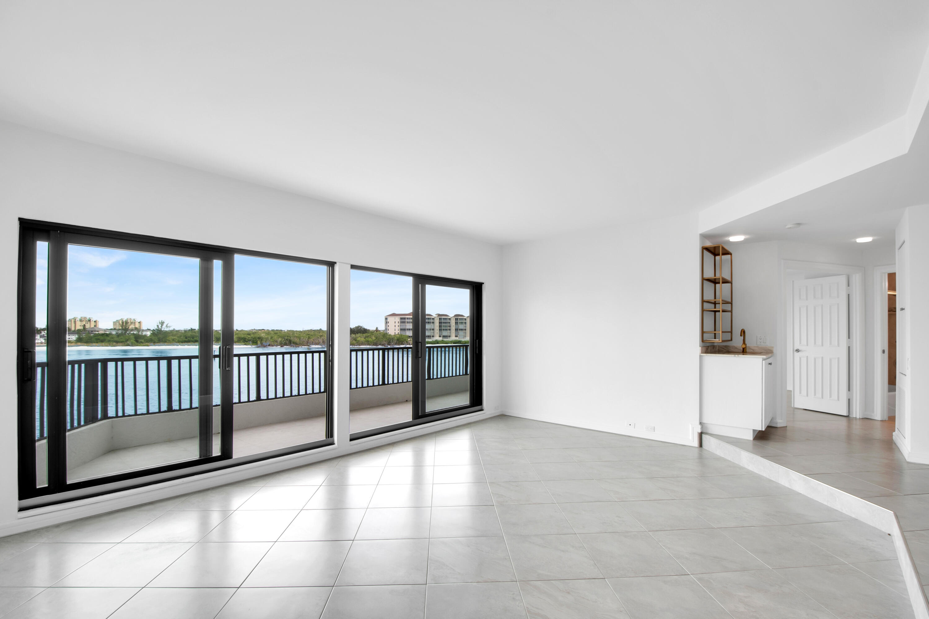 231 La Peninsula Boulevard, Unit 231 Naples, FL 34113 - Photo 2 of 42 a view of an empty room with a window